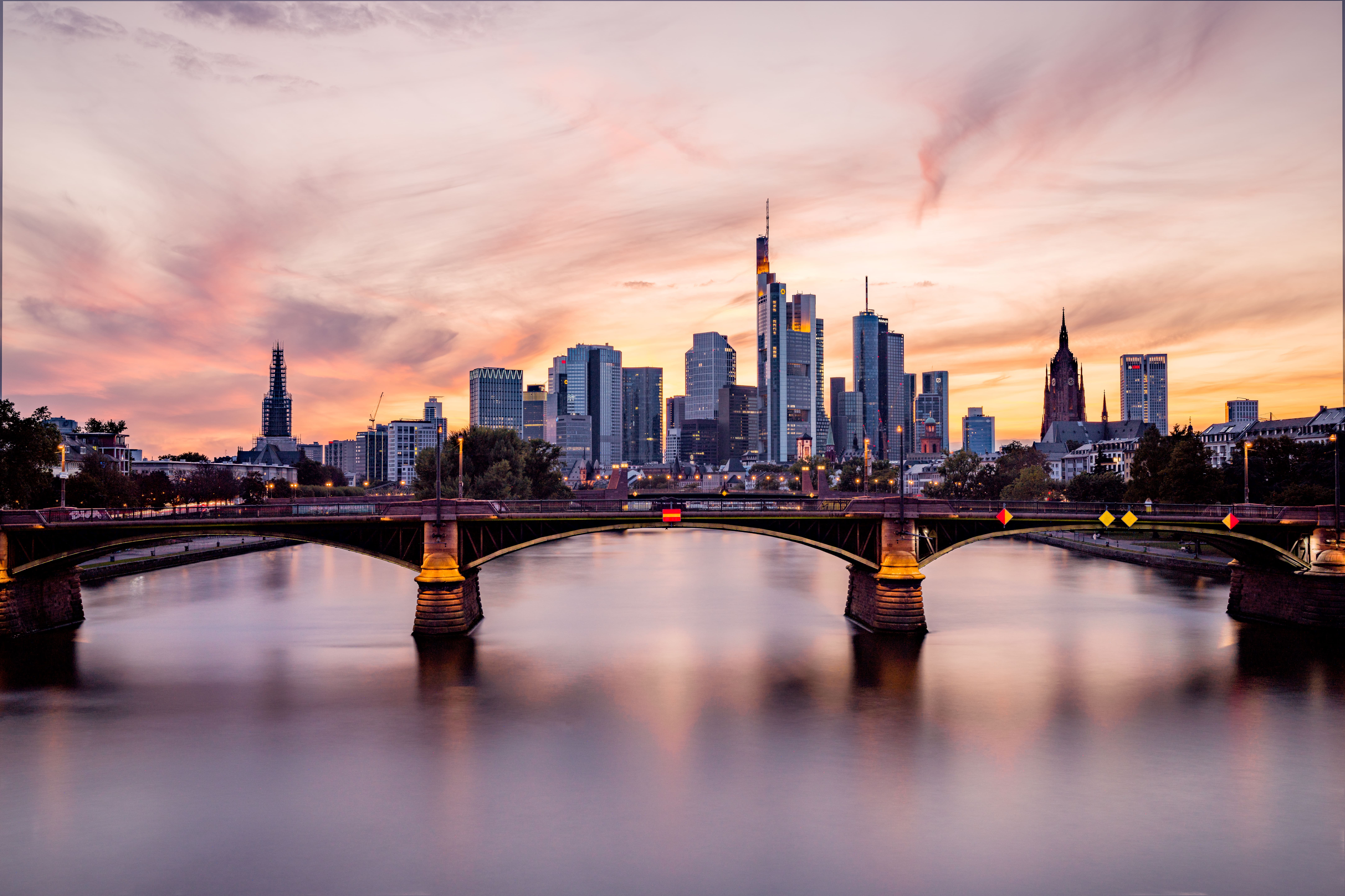 Frankfurt Skyline at Sunset,View of bridge over river against cloudy sky during sunset,Frankfurt,Germany